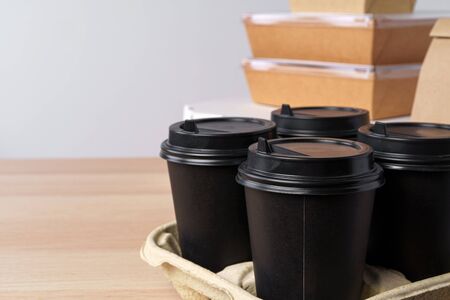 Many various take-out food containers, pizza box, coffee cups and paper bags on light grey background. Food deliveryの写真素材