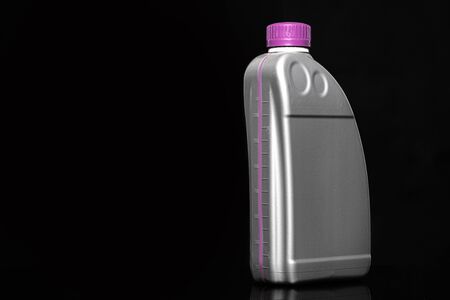 Engine oil bottle on black background.の写真素材