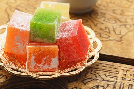 Close up of a little oriental plate with turkish delights sweetsの写真素材