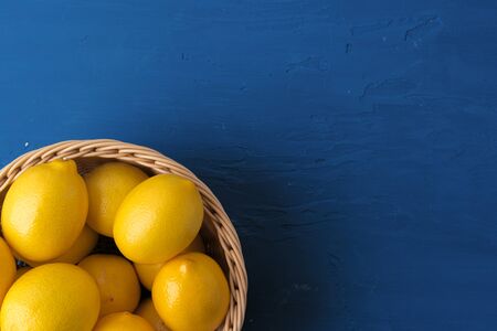 Lemon on classic blue background, top viewの写真素材