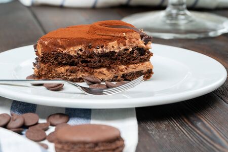 Chocolate cake with chocolate powder on top. Close up.の写真素材