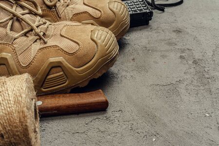 Hiking boots with travel accessories on grunge background. Close up.の写真素材