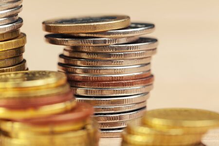 piles of coins on working table. Close up.の写真素材