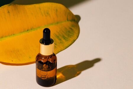Oily skincare moistrizing brown glass jar with pipette