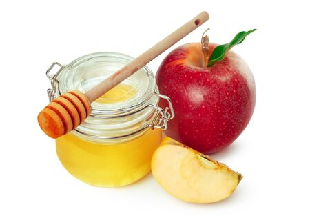 Apples and honey jar for jewish new year holiday isolated on white background. Close up.の写真素材
