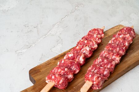 Raw turkish traditional meat kebab on the table. Close up.の写真素材