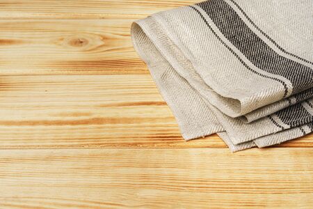 Kitchen towel or napkin over the wooden table.