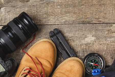 Close up photo of hiking boots and utility knifeの写真素材