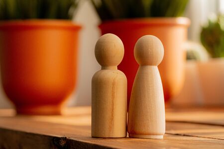 Small wooden figures of family members. Family relationship symbolの写真素材