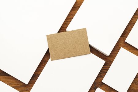 Blank businesscard stacks on rough wooden table, copy spaceの写真素材