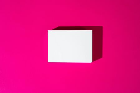 Mock-up on pink background. Businesscards with copy space close upの写真素材
