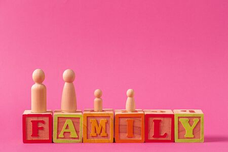 Small wooden figures of family members. Family relationship symbolの写真素材