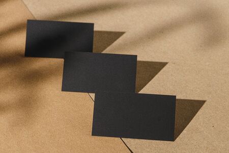 Black business cards on cork board tableの写真素材