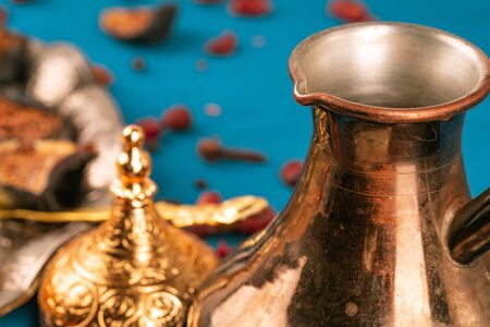 Turkish metal tableware on dark wooden table close upの写真素材
