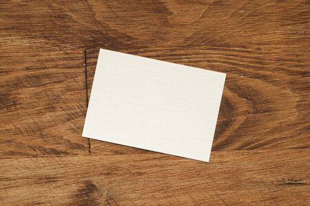 Stacks of businesscards with copy space on wooden background