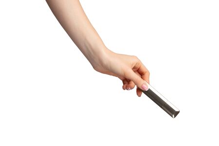Hand holding lipsticks isolated on white background
