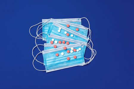 Vitamins and face protective mask. Coronavirus prevention concept