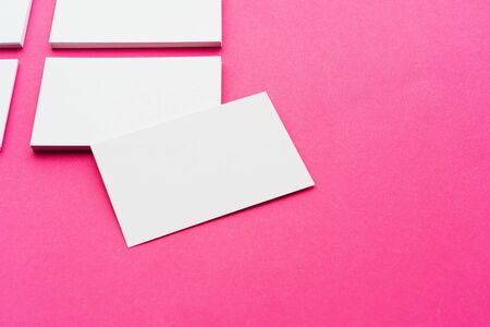 Mock-up on pink background. Businesscards with copy spaceの写真素材