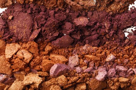 Background of smashed colored eyeshadows pigments close upの写真素材