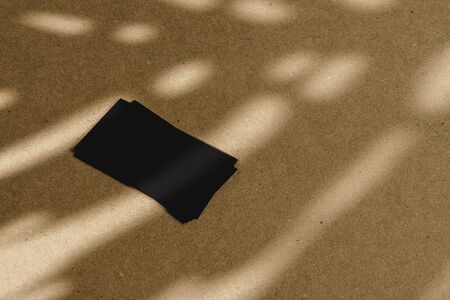 Black business cards on cork board table