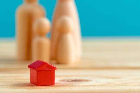 Wooden little family toys. House purchase, sale, rent conceptの写真素材