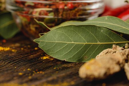 Bay leaves on brown wooden table close upの写真素材