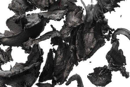Smashed dark eyeshadows isolated on white background