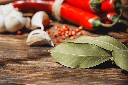 Garlic and chili pepper on dark wooden tableの写真素材