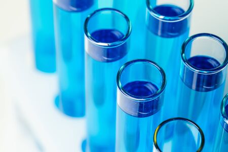 Chemical laboratory test tubes with blue liquid close upの写真素材