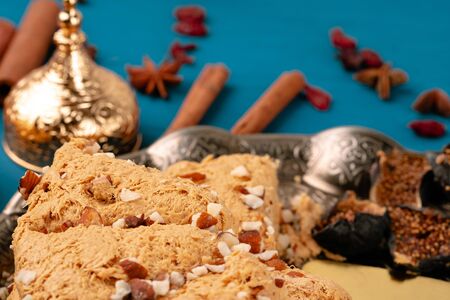 Turkish halva national dessert on blue wooden table