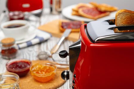 Couple of prepared toasts in a toaster, close upの写真素材