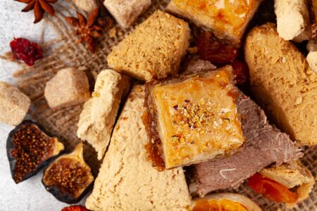 Assortment of turkish desserts baklava and halva close upの写真素材