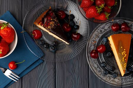 Piece of souffle cake with caramel top served with berriesの写真素材