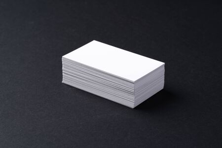 White blank business cards on dark black backgroundの写真素材