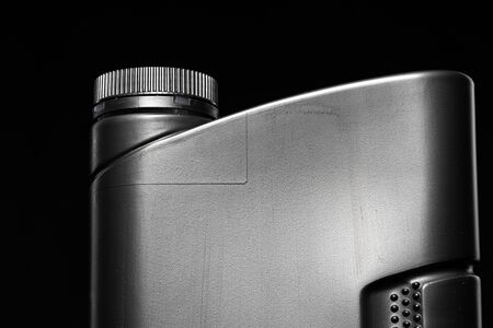 Engine oil bottle on black background, close up.の写真素材