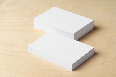 Two piles of blank business cards on table, close upの写真素材