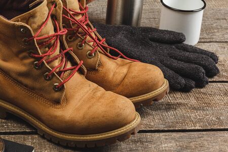 Close up photo of hiking boots and utility knife