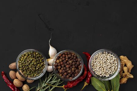 Bowls with assorted spices on dark background, top viewの写真素材