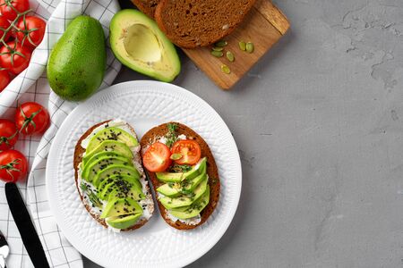 Toasted avocado sandwich for breakfast, top view. Vegan foodの写真素材