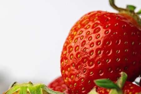 Red ripe fresh strawberry with leaves close up, copy spaceの写真素材