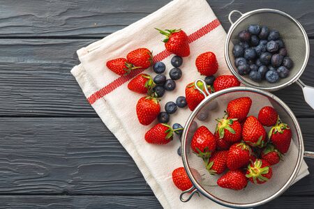 Fresh ripe strawberry and blueberry in bowl