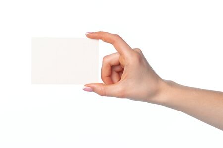 Woman's hand with blank white business card isolated on white background