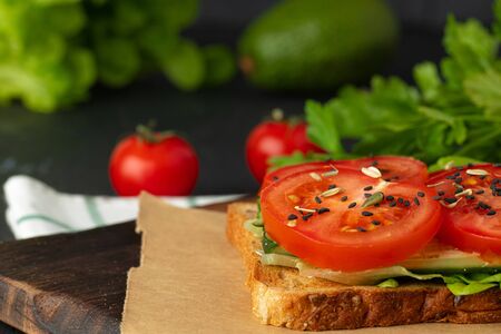 Sandwich with cream cheese, tomatoes and lettuceの写真素材
