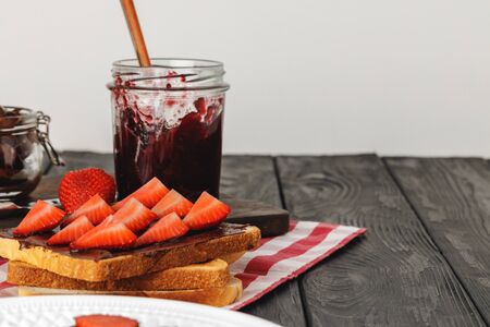 Toasted bread with chocolate paste and strawberriesの写真素材
