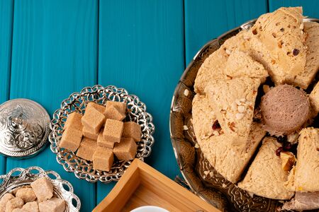 Turkish halva national dessert on blue wooden table