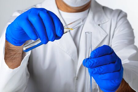 Close up of hands of a scientist working with laboratory samples