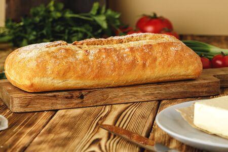 Fresh baked loaf of bread with butter bar