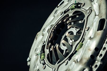 Car parts. Break disc on black background close up