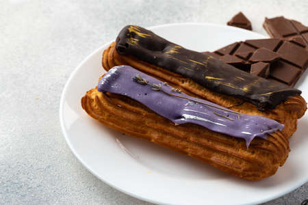 Close up photo of fresh french eclair cake with icingの写真素材