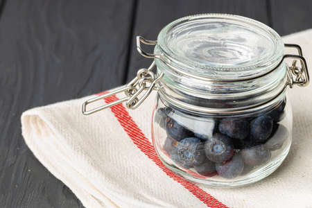 Blueberries in a glass bowl close upの写真素材